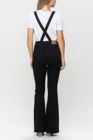 Judy Blue black denim retro flare overalls, back view with crossed adjustable straps