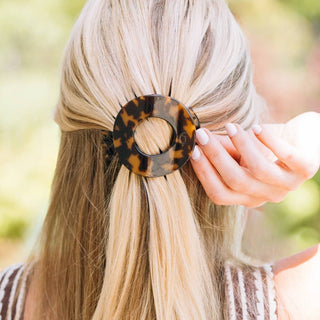 Teleties medium flat circle hair clip in tortoise, shown in hair