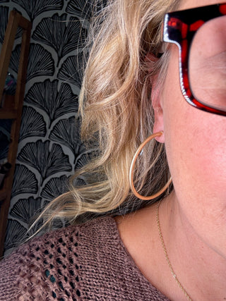 Gold Hoop Earrings – Matte Gold – model photo