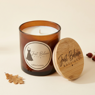 Handmade soy candle in amber glass jar with bamboo lid; Fallen Leaves label