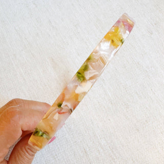 Slim tortoise-pattern headband with marble accents in pink, yellow, and green