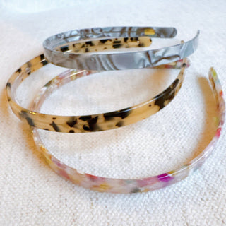 Tortoise-pattern slim headband with wide curved band, multicolor resin top view