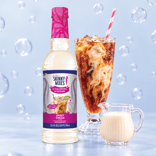 Jordan's Skinny Mixes sugar-free sweet cream dirty soda syrup bottle with tall iced drink and small cream pitcher