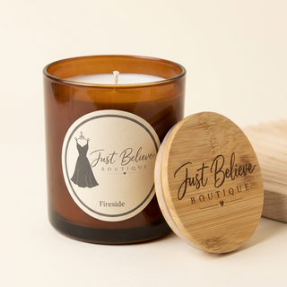 Handmade soy candle in amber glass jar with bamboo lid; Fireside label