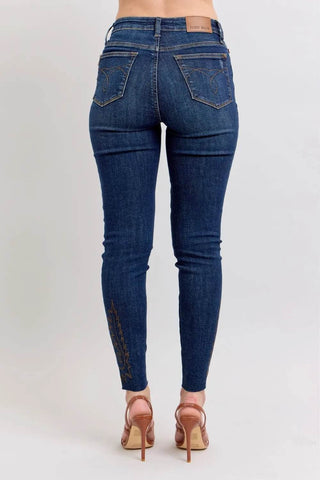 Back view of Judy Blue Plus Size High Rise Skinny Jeans with embroidered details and classic pocket stitching for a flattering silhouette.