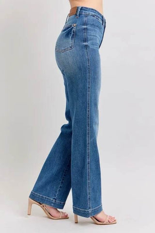 Walking pose in Plus Size High Waist Judy Blue Straight Jeans, showcasing movement-friendly straight leg cut and stylish stitching.