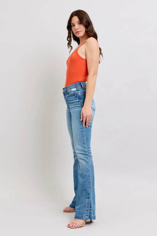 Side profile of model in Judy Blue HW Boot Jeans showing slim fit and vintage wash for a stylish everyday outfit.