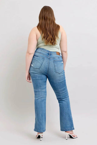 Back view of plus-size model in Judy Blue HW Boot Jeans with vintage wash and subtle distressing for a timeless denim look.