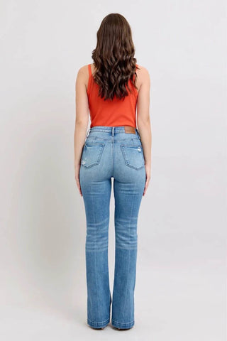 Rear view of model in Judy Blue HW Tummy Control Boot Jeans showcasing flattering fit and classic denim styling.