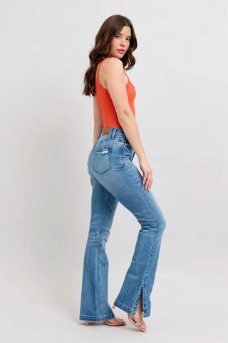 Back angled view of Judy Blue Vintage Wash Boot Jeans with side slit and tummy control waistband for enhanced comfort and style.