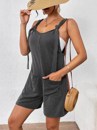 Knotted Strap Romper with Pockets for Women styled with a sun hat and crossbody bag, perfect for casual summer fashion.
