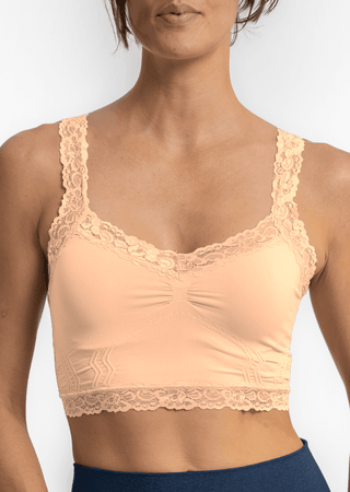 Blush lace bralette with scalloped lace trim, V neckline, and ruched bust