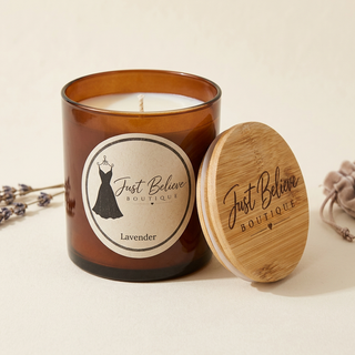 Handmade soy candle in amber glass jar with bamboo lid; Lavender label