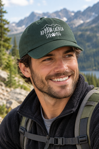 Man wearing the green ApPAWlachia Strong Baseball Cap