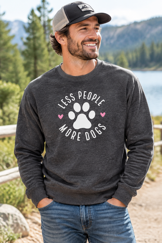 Man wearing the dark gray Less People More Dogs sweatshirt