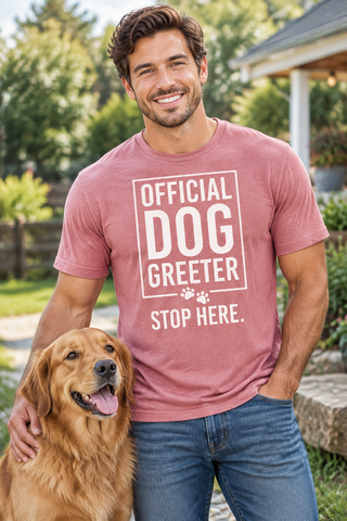 Man wearing the pink Official Dog Greeter T-Shirt