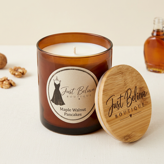 Handmade soy candle in amber glass jar with bamboo lid; Maple Walnut Pancakes label