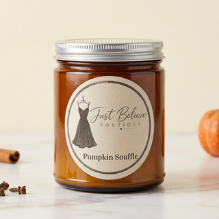 Handmade soy candle in amber glass jar with metal lid; Pumpkin Souffle label