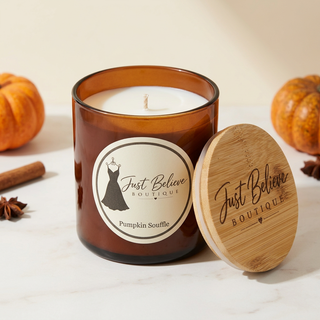 Handmade soy candle in amber glass jar with bamboo lid; Pumpkin Souffle label
