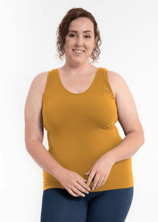 Reversible curvy-fit tank top in gold, scoop neckline, sleeveless.