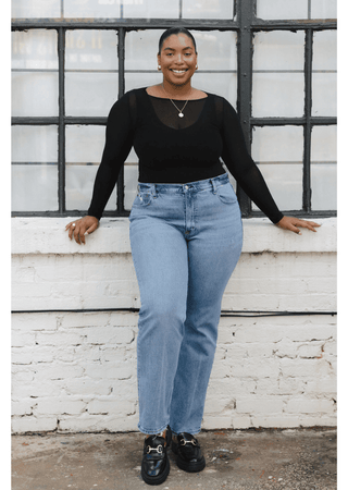 Black sheer fitted long-sleeve top with round neckline