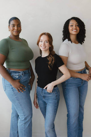 Waist-length crewneck short-sleeve tops in green, black, and white (shown)