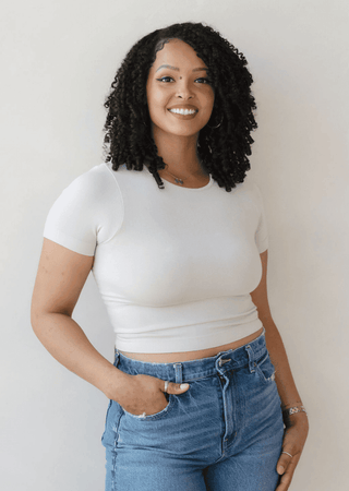 White waist-length crewneck short-sleeve top, fitted and smooth