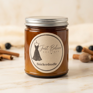 Handmade soy candle in amber glass jar with metal lid; Snickerdoodle label