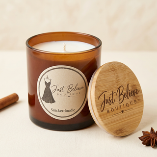 Handmade soy candle in amber glass jar with bamboo lid; Snickerdoodle label