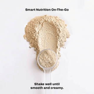 Meal replacement shake powder in scoop and small measuring cup