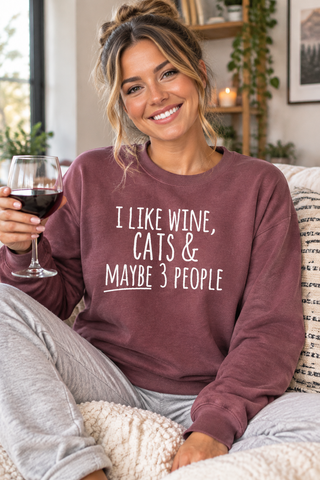 Woman smiling while wearing the I Like Wine, Cats & Maybe 3 People Sweatshirt