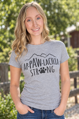 Woman smiling in an Ap-paw-lachia Strong tee