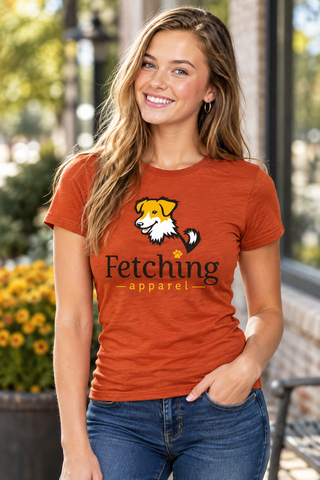 Woman wearing a rust Fetching fitted tee with the rescue dog graphic