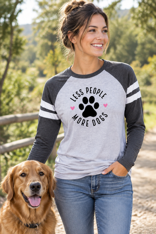 Woman wearing the Less People More Dogs Baseball Tee