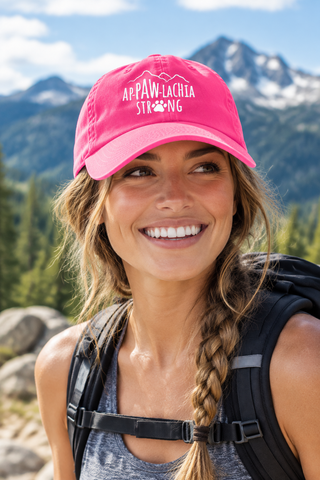 Woman wearing the fuchsia ApPAWlachia Strong Baseball Cap