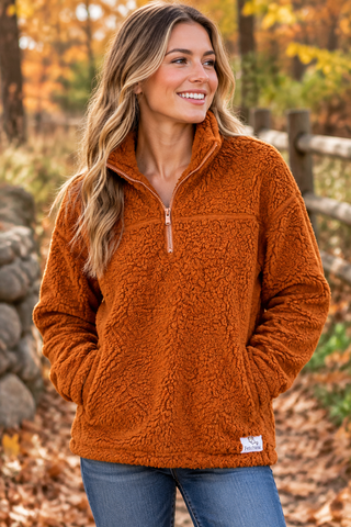 Woman wearing the Pumpkin Spice sherpa quarter-zip