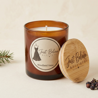 Amber soy candle jar with open wooden lid, Woodland Snow label