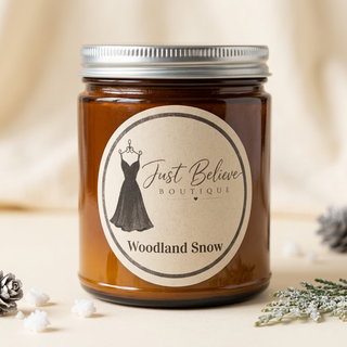 Amber glass jar soy candle with Woodland Snow label