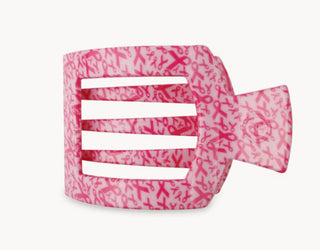 Pink flat square hair clip with white stripe detail and ribbon-like wrap
